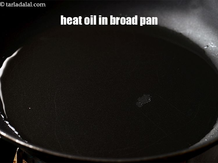 Step 12 – Heat 1&frac12; tbsp oil in a broad non-stick pan.