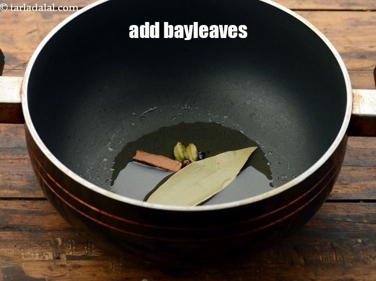 Step 21 – Add <a href="https://www.tarladalal.com/glossary-bayleaf-tejpatta-tej-patta-189i" target="_blank">bayleaves</a>.