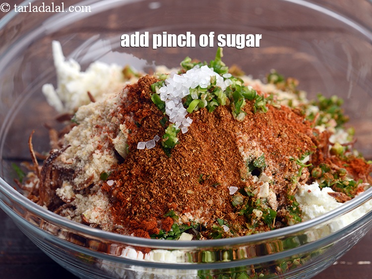Step 12 – Add a pinch of&nbsp;<a href="https://tarladalal.com/glossary-sugar-chini-shakkar-278i">sugar</a>.&nbsp;