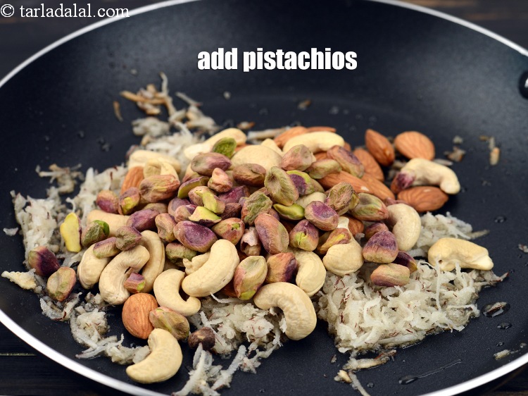 Step 12 – Add 4 tbsp&nbsp;<a href="https://www.tarladalal.com/glossary-pistachios-pista-891i">pistachios</a>.&nbsp;