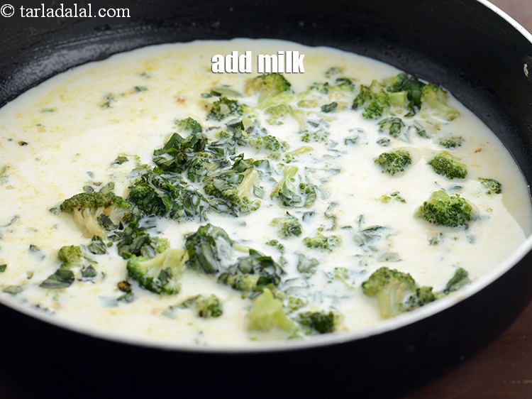 Step 12 – Add 1 cup <a href="https://www.tarladalal.com/glossary-milk-doodh-full-cream-milk-514i">milk</a>.