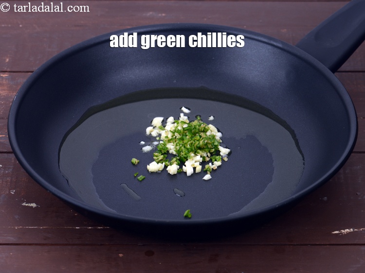 Step 12 – Add 2 tsp&nbsp;finely&nbsp;<a href="https://www.tarladalal.com/glossary-chopped-green-chilli-820i">chopped green chillies</a>.&nbsp;