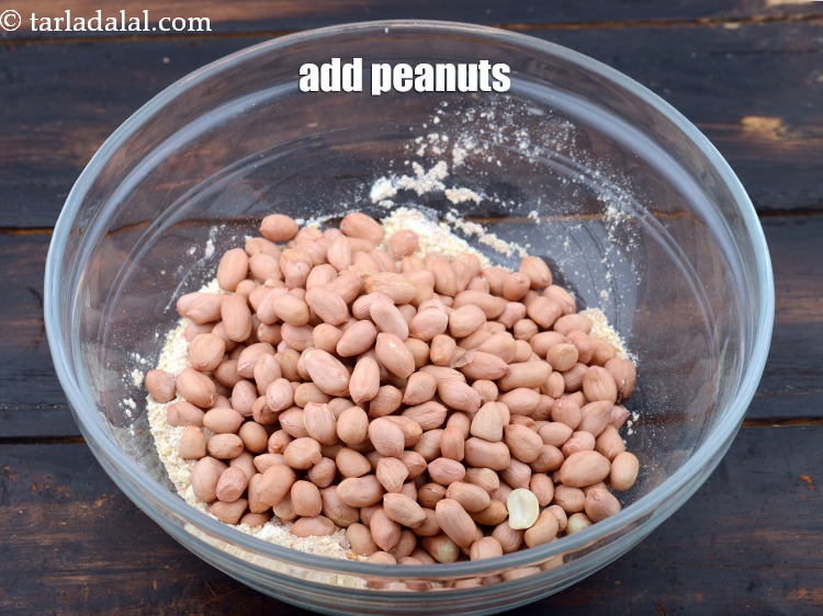 Step 12 – Add 1 cup&nbsp;<a href="https://www.tarladalal.com/glossary-raw-peanuts-kachi-mungfali-kachi-moongfali-847i">raw peanuts</a>.&nbsp;