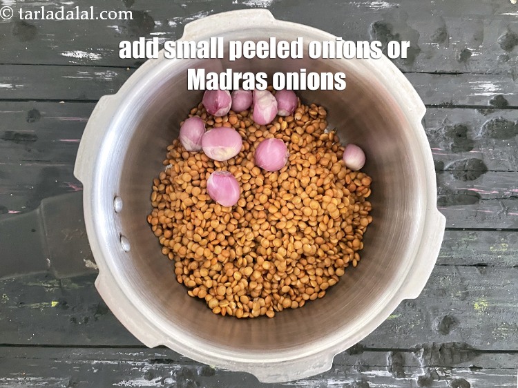 Step 20 – Add&nbsp;<meta charset="UTF-8" />7 to 8&nbsp;small sized&nbsp;<a href="glossary-white-onions-554i">white onions</a>&nbsp; ( Madras onions or shallots )&nbsp;, peeled.
