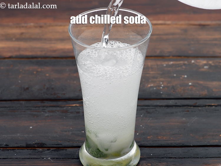 Step 12 – Add &frac12; cup chilled&nbsp;<a href="https://www.tarladalal.com/glossary-soda-club-water-614i">soda</a>.