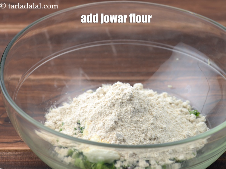 Step 12 – Add 1/4 cup <a href="https://www.tarladalal.com/glossary-jowar-flour-jowar-ka-atta-white-millet-flour-sorghum-flour-483i">jowar (white millet) flour</a>.