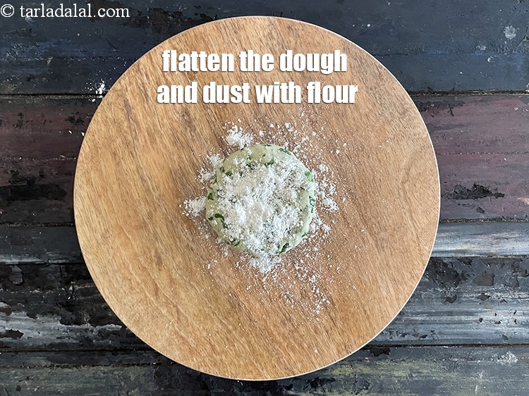 Step 15 – Place a portion of the dough on it and flatten it.&nbsp;
