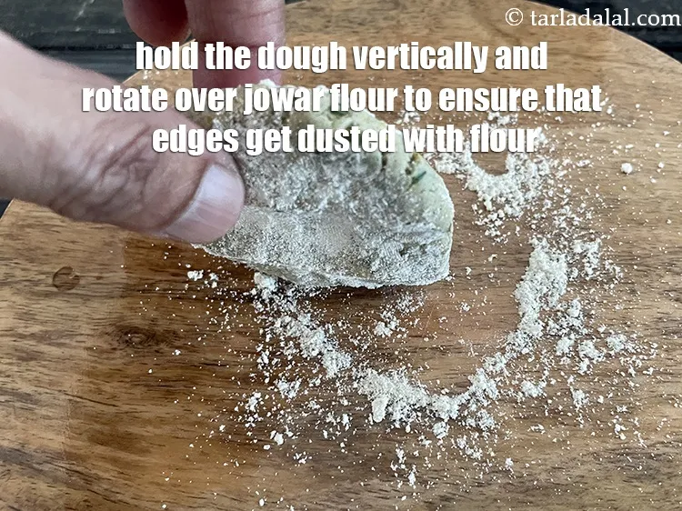 Step 15 – Hold the dough vertically and rotate over jowar flour to ensure that the sides get …