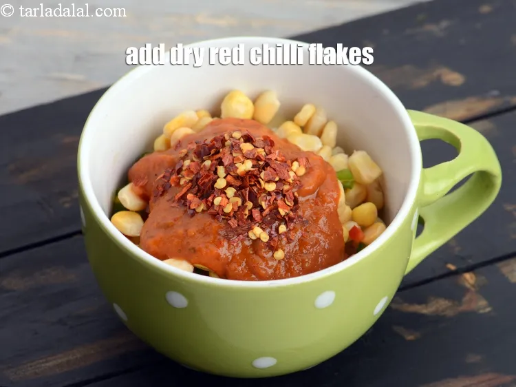 Step 12 – Add &frac12; tsp <a href="https://www.tarladalal.com/glossary-dry-red-chilli-flakes-paprika-338i">dry red chilli flakes (paprika)</a>.