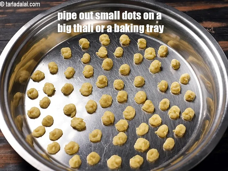 Step 19 – Now pipe out small dots on a big thali or a baking tray.