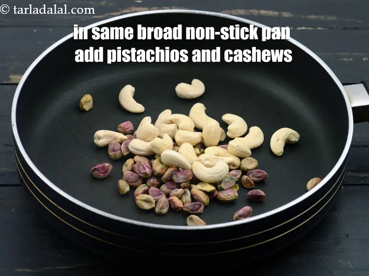 स्टेप 12 – उसी चौड़े नॉन-स्टिक पैन में, 1/4 कप&nbsp;<a href=""https://www.tarladalal.com/glossary-pistachios-pista-hindi-891i"" target=""_blank"">&nbsp;पिस्ते</a>&nbsp;और 1/4 …