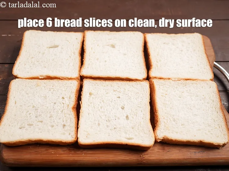 Step 12 – <p>Place 6 <a href="https://www.tarladalal.com/glossary-bread-219i">bread slices</a> on a clean, dry surface.</p>