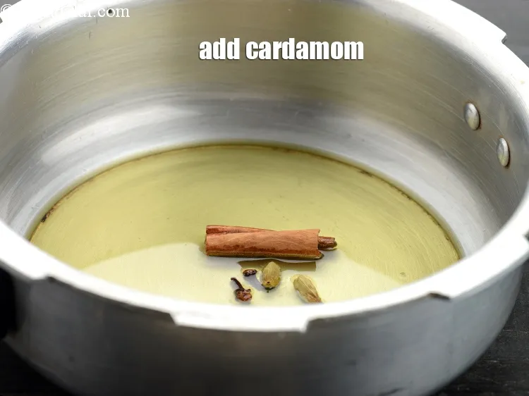 Step 17 – Add 2&nbsp;<a href="https://www.tarladalal.com/glossary-cardamom-elaichi-262i">cardamoms (elaichi)</a>.