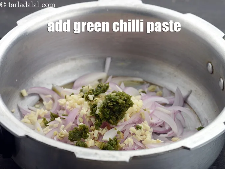 Step 15 – Add 2 tsp&nbsp;<a href="https://www.tarladalal.com/glossary-green-chilli-paste-hari-mirch-ki-paste-mirchi-paste-333i">green chilli paste</a>.