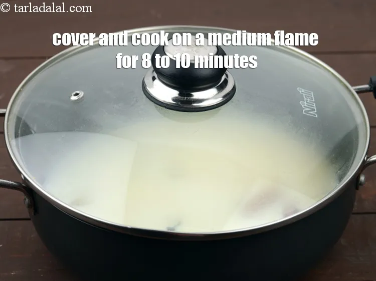Step 14 – Mix well and cover and cook on a medium flame for 8 to 10 minutes …