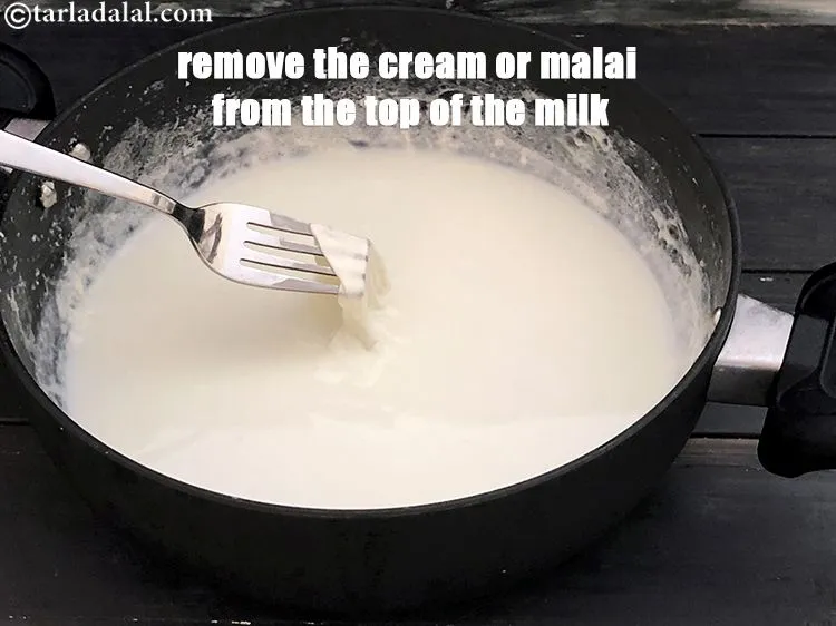 Step 11 – Remove the cream or malai from the top off the milk. We are removing the …
