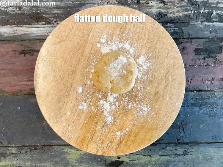 Step 13 – <meta charset="UTF-8" />Flatten the dough ball with your palms and place on the board for …