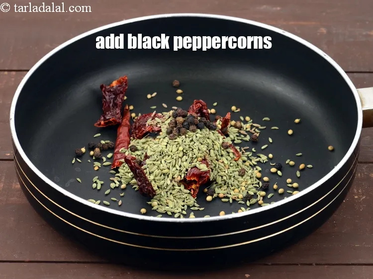 Step 13 – Add 1 tsp <a href="https://www.tarladalal.com/glossary-black-peppercorns-kali-mirch-kalimirch-566i">black peppercorns (kalimirch)</a>.