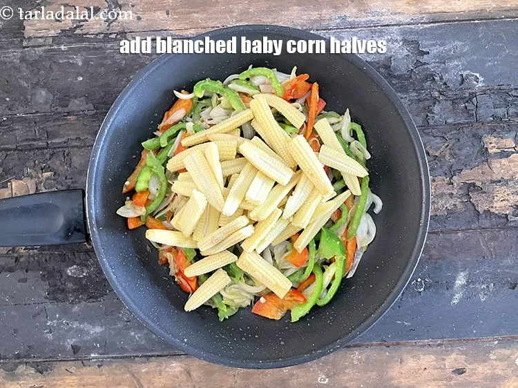 स्टेप 12 – १ १/२ कप <a href=""https://www.tarladalal.com/glossary-blanched-baby-corn-hindi-721i"">हल्के उबले हुए बेबी कॉर्न के …