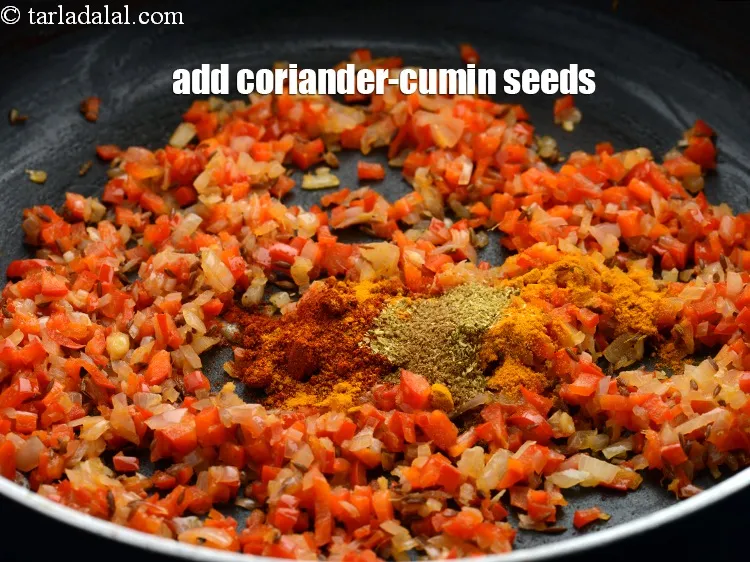 Step 12 – Add &frac12; tsp <a href="https://www.tarladalal.com/glossary-coriander-cumin-seeds-powder-dhania-jeera-powder-375i">coriander-cumin seeds (dhania-jeera)</a>.