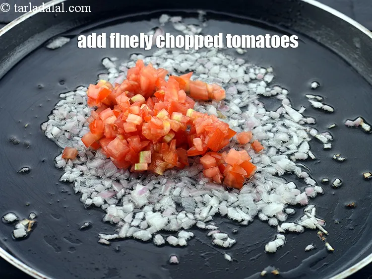 Step 12 – Add the 1/4 cup finely&nbsp;<a href="https://www.tarladalal.com/glossary-chopped-tomatoes-779i">chopped tomatoes</a>.