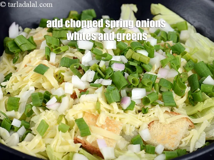 Step 12 – Add 1/2 cup <a href="https://www.tarladalal.com/glossary-chopped-spring-onion-whites-815i">chopped spring onions whites</a>&nbsp;and greens.