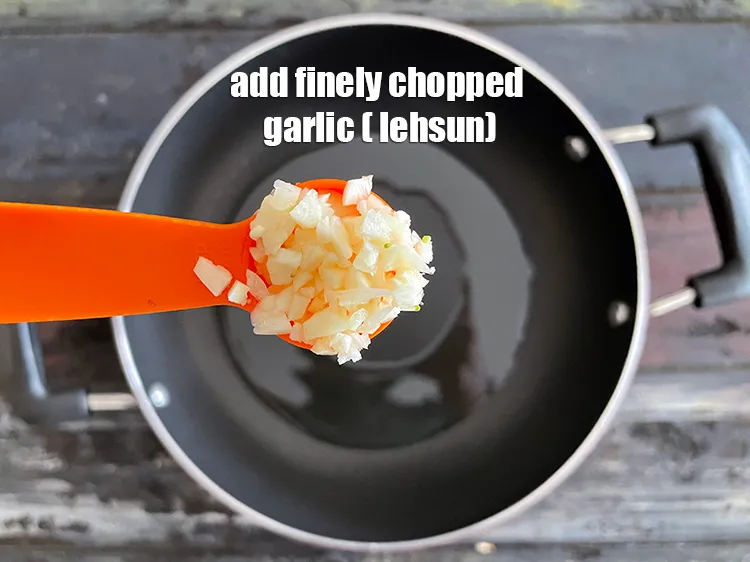 Step 19 – Add<strong> 2</strong>&nbsp;tsp&nbsp;finely&nbsp;<a href="glossary-chopped-garlic-790i">chopped garlic (lehsun)</a>.