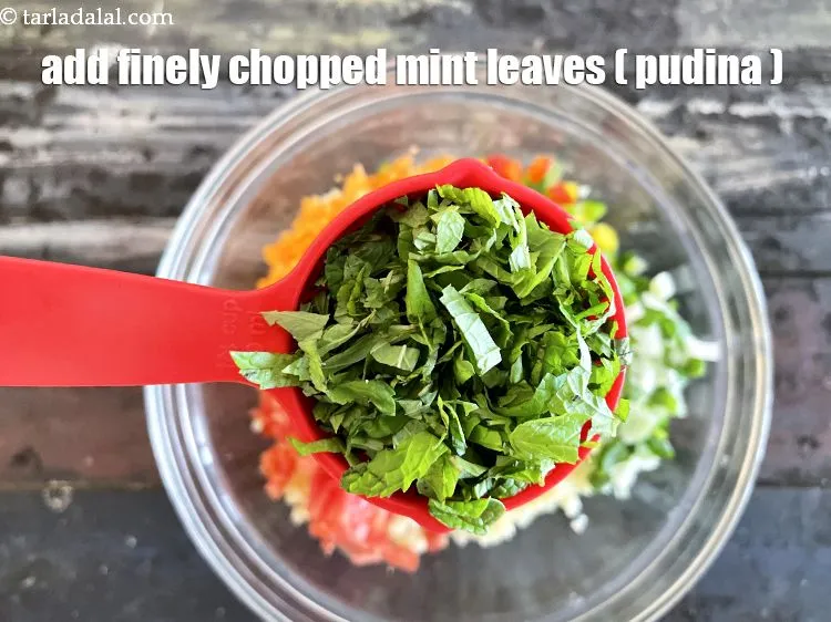 Step 20 – Add&nbsp;<meta charset="UTF-8" />1/4 cup&nbsp;finely&nbsp;<a href="glossary-chopped-mint-788i">chopped mint leaves (phudina)</a>.