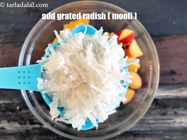 Step 25 – Add&nbsp;<meta charset="UTF-8" />1/2 cup&nbsp;<a href="glossary-grated-radish-953i">grated radish (mooli)</a>.