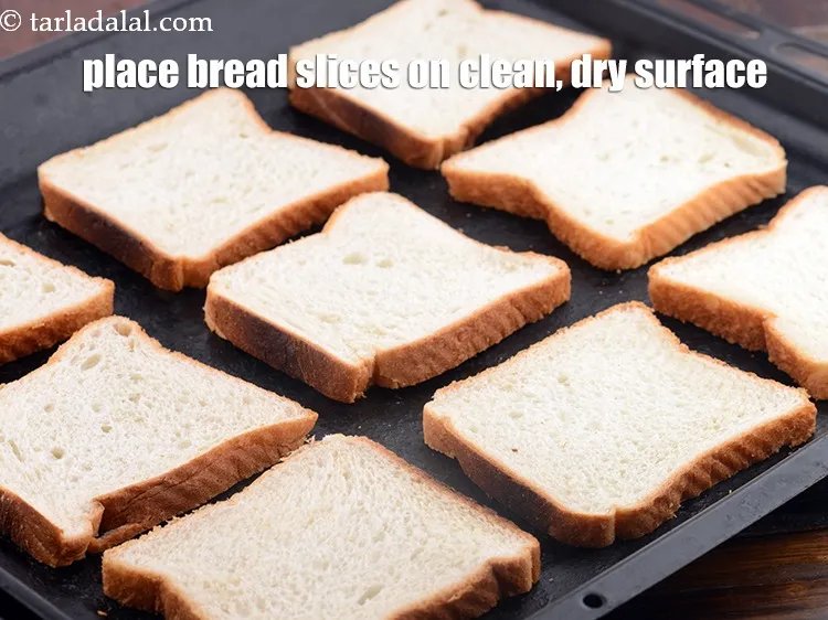 Step 12 – Place all the 9&nbsp;<a href="https://www.tarladalal.com/glossary-bread-219i">bread slices</a>&nbsp;on a clean, dry surface.