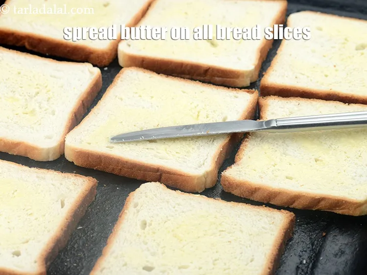 Step 12 – Spread 1 tsp <a href="https://www.tarladalal.com/glossary-butter-makhan-233i">butter</a>&nbsp;on all bread slices.&nbsp;