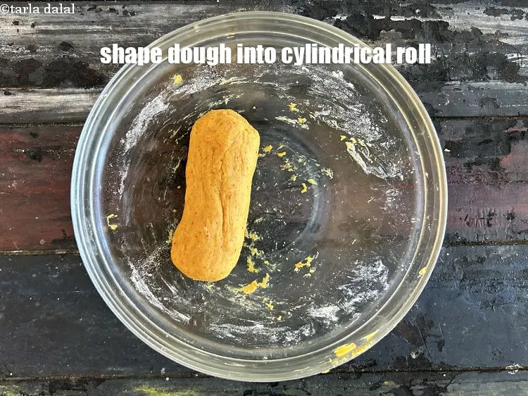 Step 13 – <p>To prepare<strong>&nbsp;baked ribbon sev</strong>, shape the dough into a cylindrical roll. Before adding the dough …