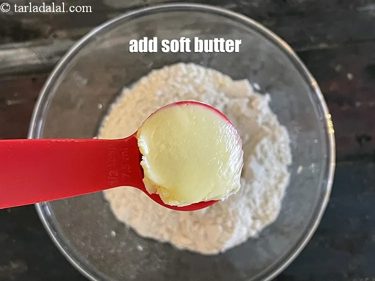 Step 12 – Add&nbsp;<meta charset="UTF-8" />1/2 tbsp&nbsp;<a href="glossary-soft-butter-naram-makhan-1942i">soft butter</a>.