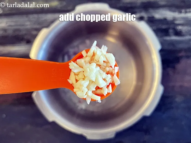 Step 12 – Add&nbsp;2 tsp&nbsp;<a href="glossary-chopped-garlic-790i">chopped garlic (lehsun)</a>.