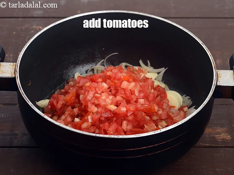 Step 12 – Add 1 cup&nbsp;finely&nbsp;<a href="https://tarladalal.com/glossary-chopped-tomatoes-779i">chopped tomatoes</a>.&nbsp;