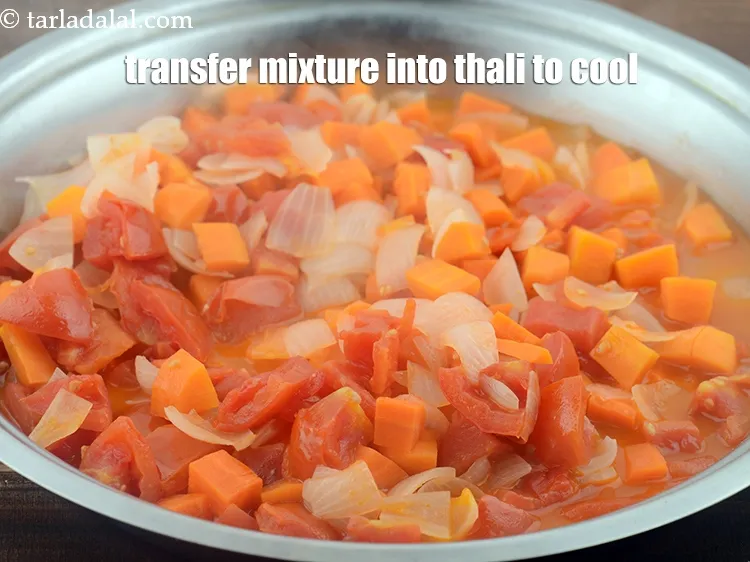 Step 12 – Transfer the mixture into a big thali to cool completely.&nbsp;