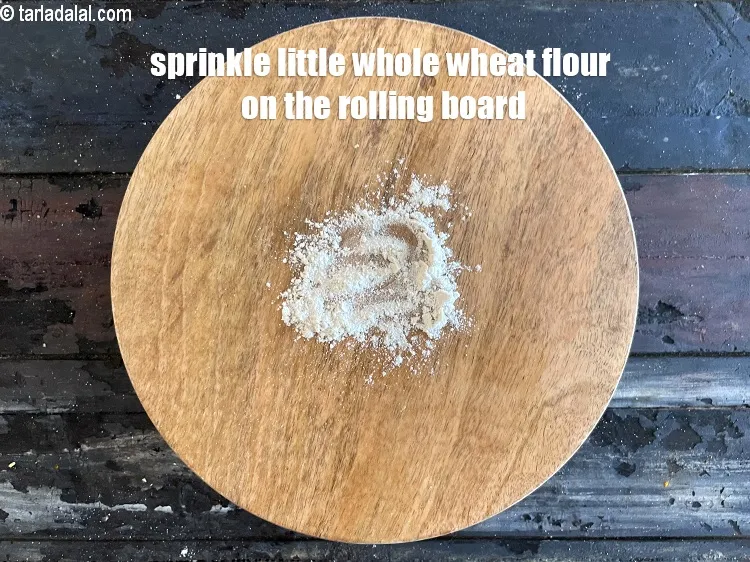 Step 12 – <meta charset="UTF-8" />Sprinkle a little whole wheat flour on the rolling surface.&nbsp;