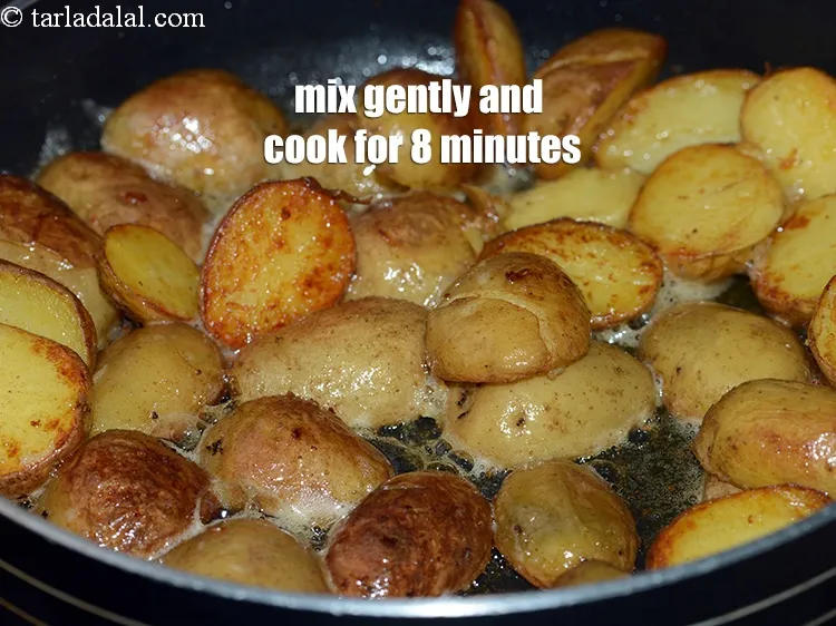 Step 13 – Mix gently and cook on a medium flame for 8 minutes, while tossing occasionally.