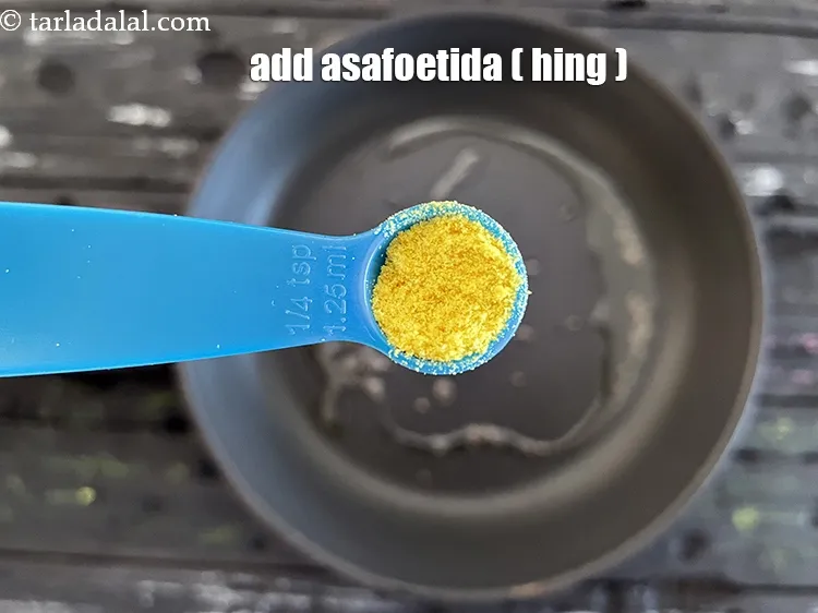 Step 12 – Add&nbsp;<meta charset="UTF-8" />1/4 tsp&nbsp;<a href="glossary-asafoetida-hing-113i">asafoetida (hing)</a>.