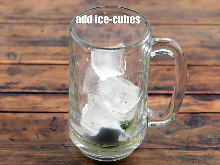 Step 12 – Add 6 <a href="https://www.tarladalal.com/glossary-ice-cubes-752i">ice-cubes</a>.&nbsp;