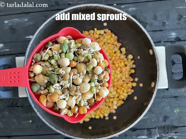 Step 13 – Add&nbsp;<meta charset="UTF-8" />1 cup&nbsp;<a href="glossary-mixed-sprouts-195i">mixed sprouts</a>&nbsp;(moong , chana , matki (moath beans) etc.).