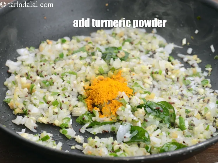 Step 14 – Add &frac12; tsp <a href="https://www.tarladalal.com/glossary-turmeric-powder-haldi-645i">turmeric powder (haldi)</a>.