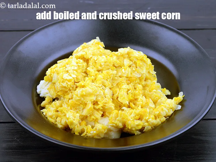 Step 13 – Add 3/4 cup&nbsp;<a href="https://www.tarladalal.com/glossary-boiled-and-crushed-sweet-corn-kernels-1930i">boiled and crushed sweet corn kernels</a>.