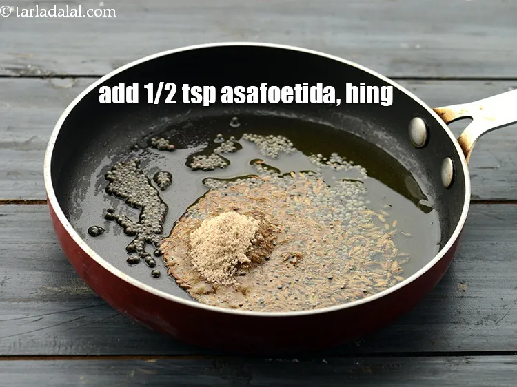 Step 21 – Add 1/2 tsp&nbsp;<a href="https://www.tarladalal.com/glossary-asafoetida-hing-113i">asafoetida (hing)</a>.