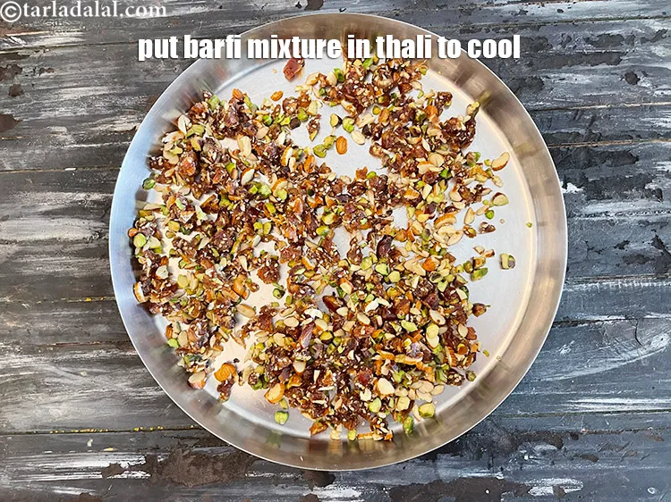 स्टेप 15 – बर्फी के मिश्रण को ठंडा होने के लिये रख दीजिये।&nbsp;हमने …