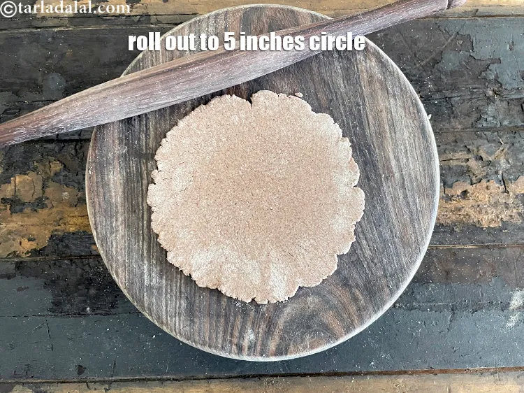 Step 23 – Roll out a portion&nbsp;into a 125 mm. (5") diameter thick circle.&nbsp;