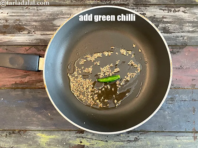 Step 13 – <html><head></head><body><p>Add&nbsp;1&nbsp;<a href="glossary-green-chillies-hari-mirch-331i">green chilli, slit</a>.</p></body></html>