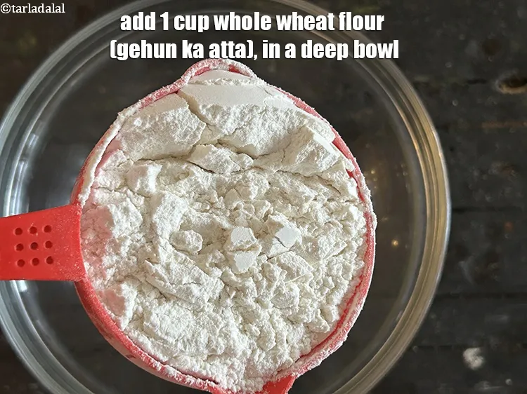 Step 13 – Combine 1 cup <a href="https://www.tarladalal.com/glossary-whole-wheat-flour-gehun-ka-atta-gehun-ka-aata-429i">whole wheat flour (gehun ka atta)</a>, in a deep bowl.