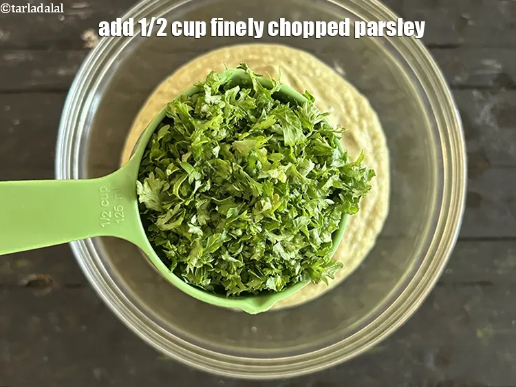 Step 15 – Add&nbsp;<meta charset="UTF-8" />1/2 cup&nbsp;finely&nbsp;<a href="glossary-chopped-parsley-793i">chopped parsley</a>.&nbsp;