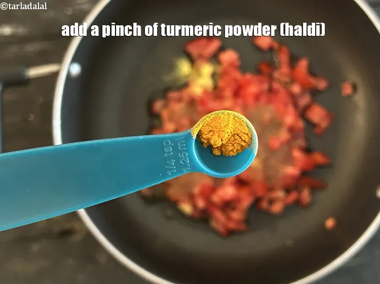 Step 15 – <meta charset="UTF-8" />Add a pinch of&nbsp;<a href="glossary-turmeric-powder-haldi-645i">turmeric powder (haldi)</a>.